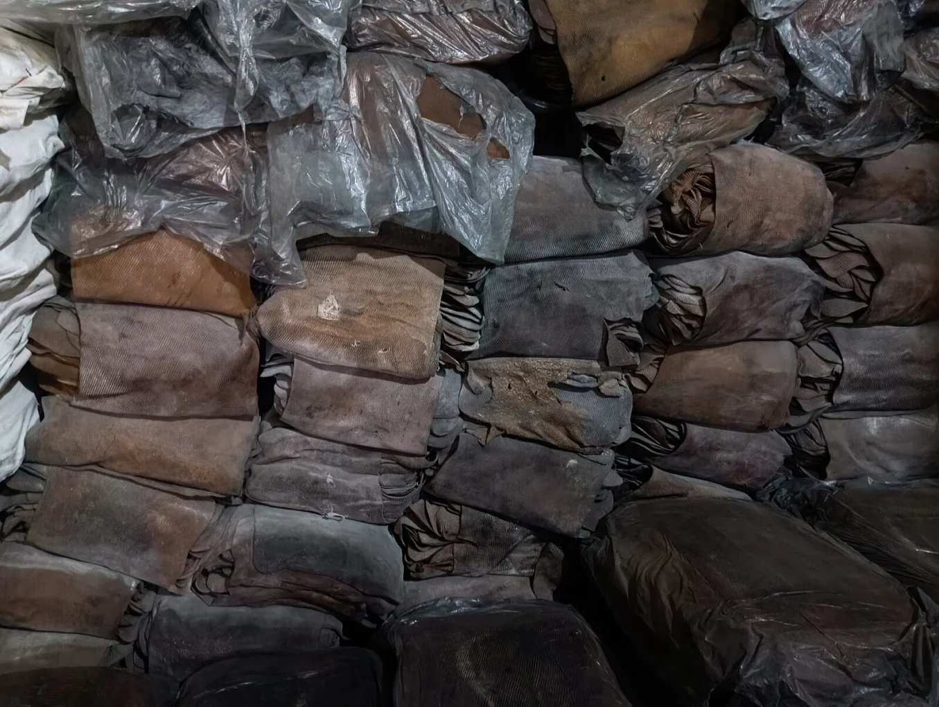 EPDM reclaim rubber bales stacked in warehouse storage
